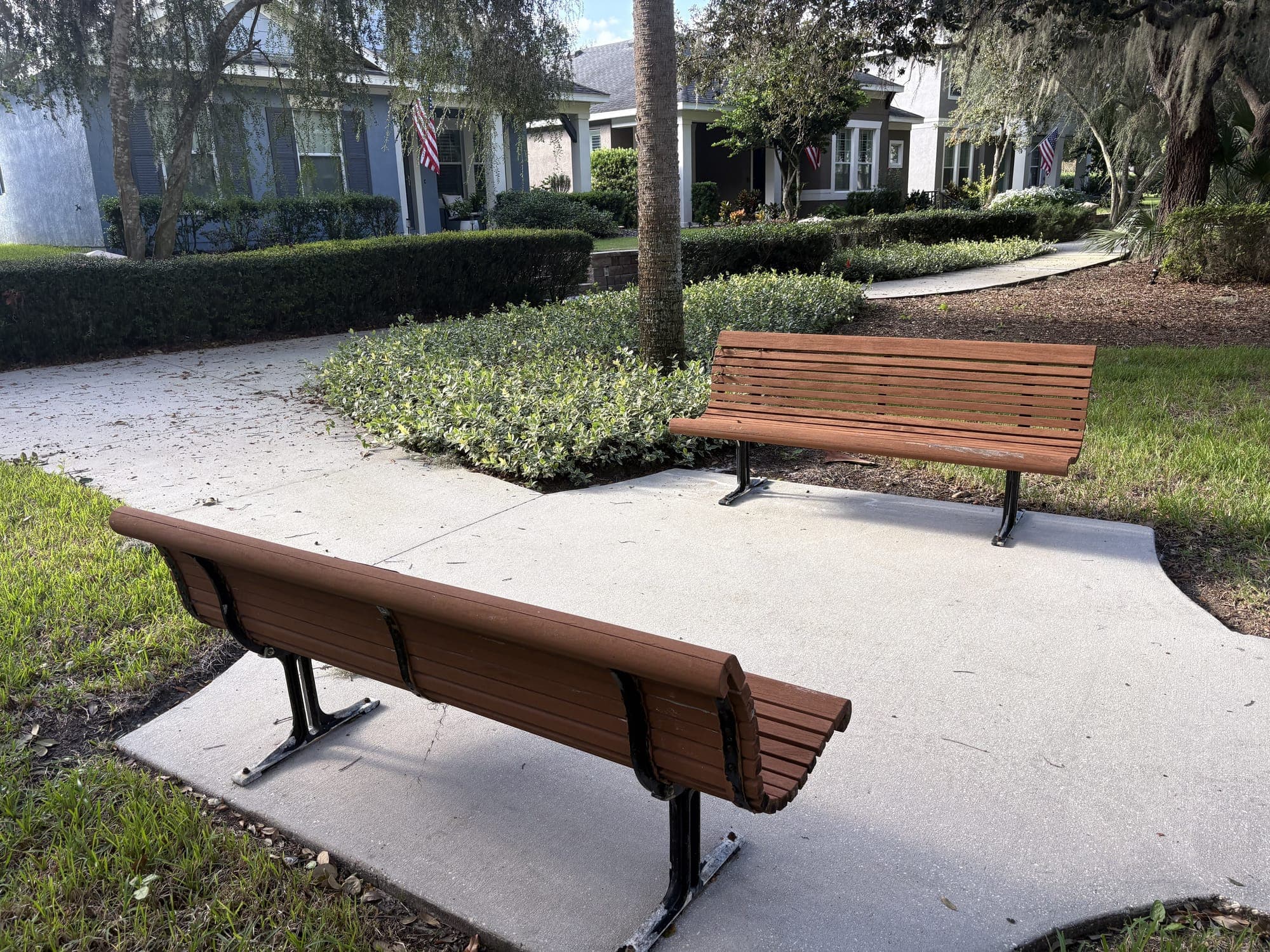 The bench from behind, looking across the lawn to the other bench.
